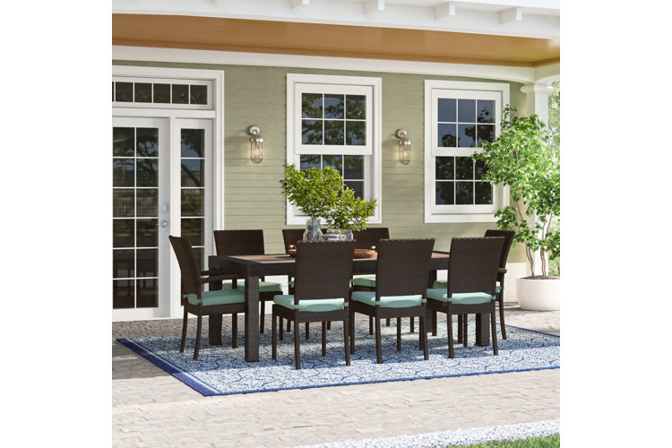 Angelos 9 piece discount dining set with cushions